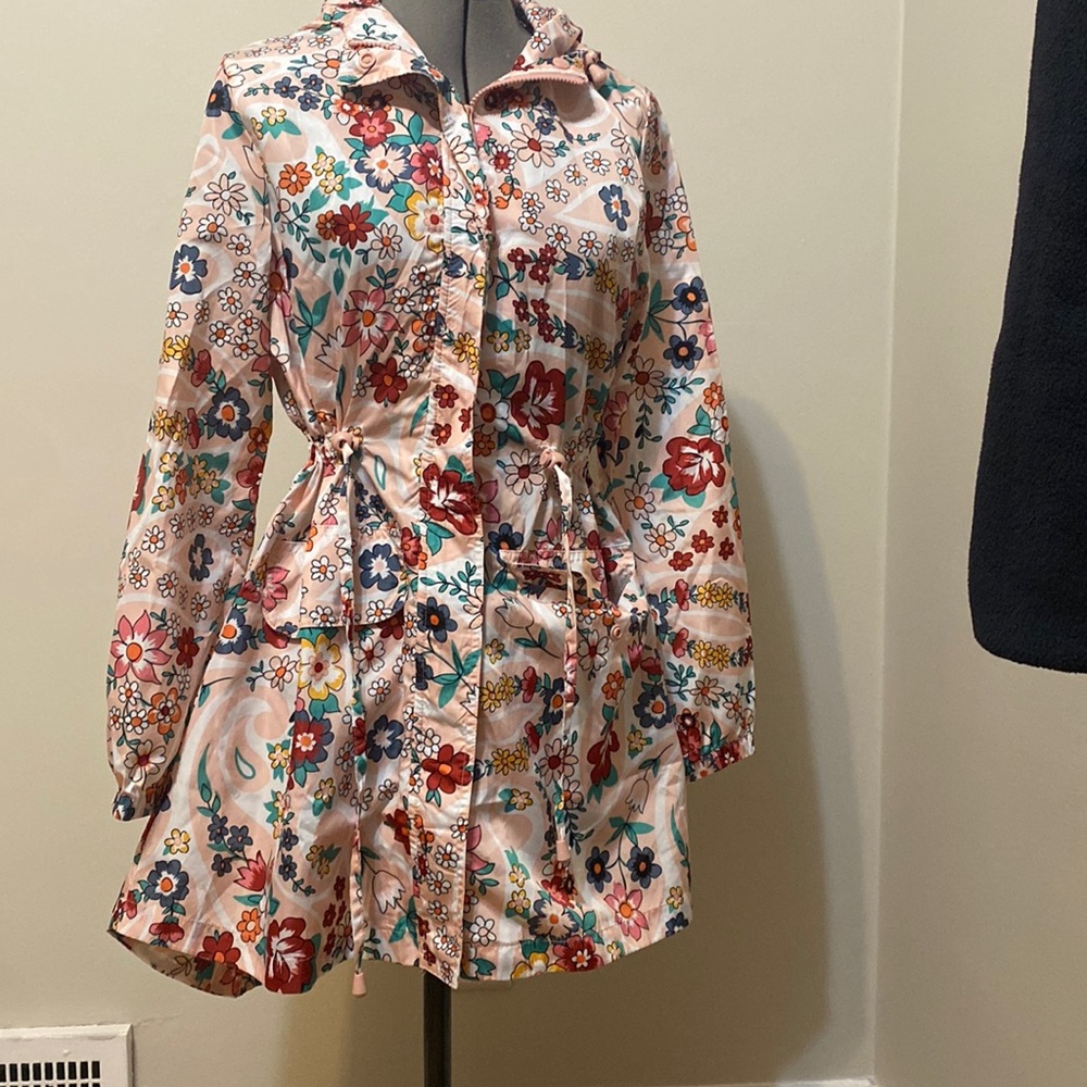 Vera Bradley floral raincoat in blush pink.